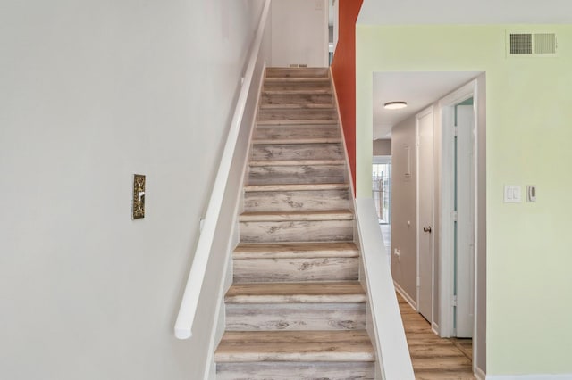 stairway with wood-type flooring