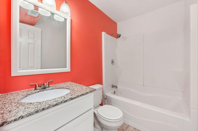 full bathroom featuring bathtub / shower combination, vanity, and toilet