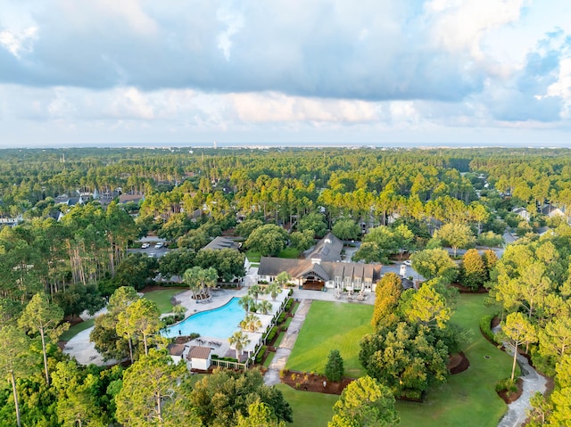 birds eye view of property featuring a wooded view