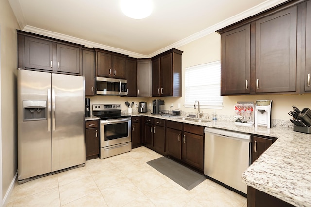 kitchen featuring dark brown cabinetry, light stone countertops, sink, stainless steel appliances, and ornamental molding