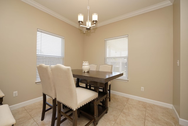 tiled dining space featuring crown molding and an inviting chandelier