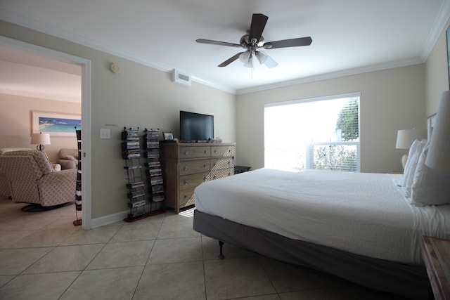 tiled bedroom featuring ceiling fan and crown molding