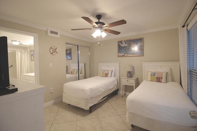 bedroom featuring light tile patterned floors, a closet, ceiling fan, and ornamental molding