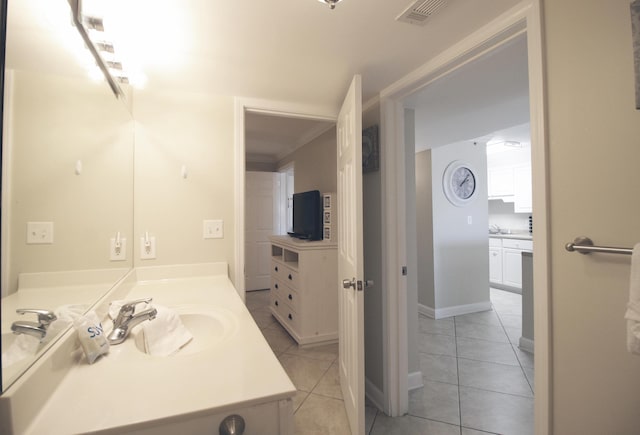 bathroom with tile patterned flooring, vanity, and ornamental molding