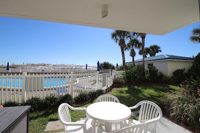 view of patio / terrace featuring a community pool