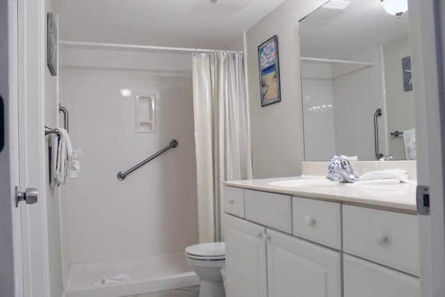 bathroom featuring a shower with shower curtain, vanity, toilet, and tile patterned floors