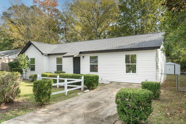 single story home with a storage unit