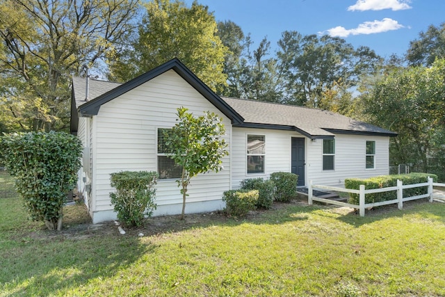 ranch-style house with a front yard