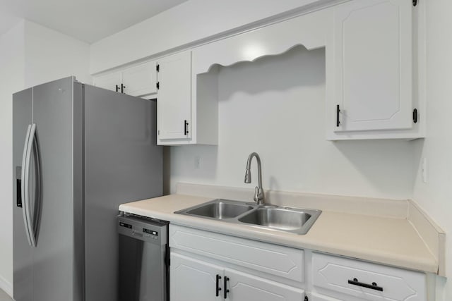 kitchen featuring white cabinets, sink, and appliances with stainless steel finishes