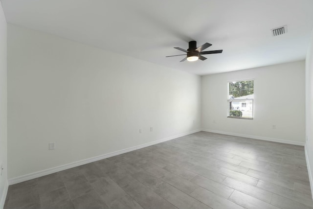 unfurnished room with ceiling fan and hardwood / wood-style floors