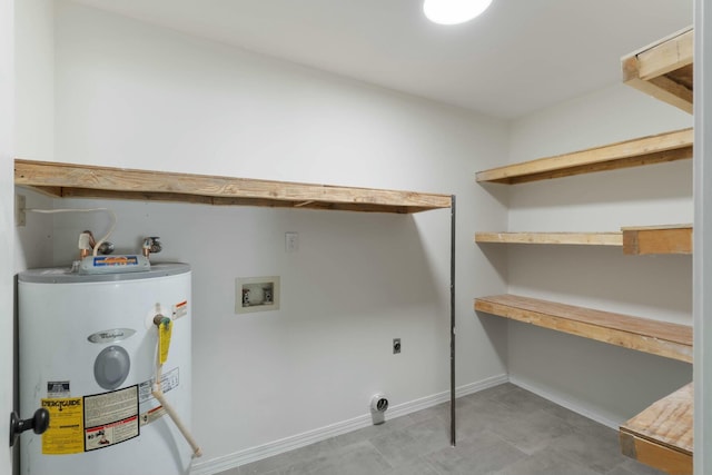 clothes washing area with water heater, washer hookup, and hookup for an electric dryer