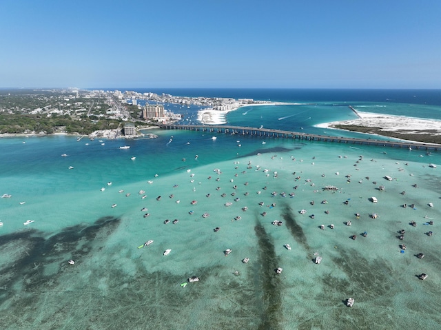 aerial view featuring a water view and a beach view