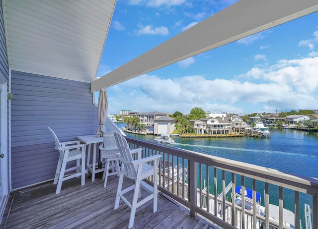 wooden terrace with a water view