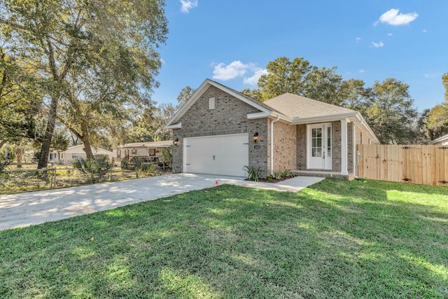 ranch-style home with brick siding, a front yard, fence, a garage, and driveway