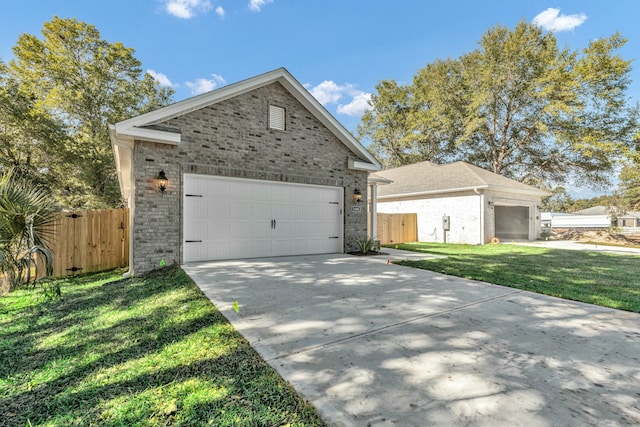 view of front of property with a front yard and a garage