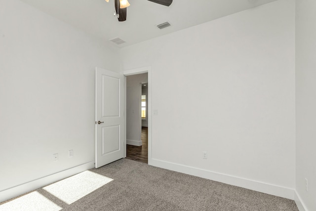 carpeted empty room with ceiling fan