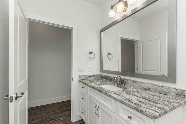 bathroom with hardwood / wood-style flooring and vanity