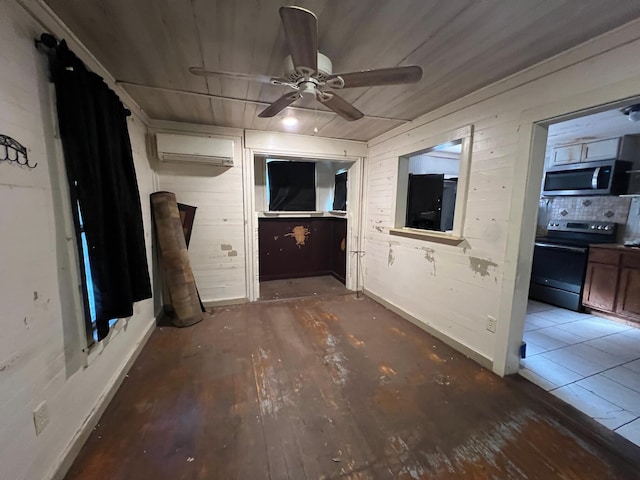 interior space with a wall unit AC, wooden walls, ceiling fan, and dark hardwood / wood-style floors