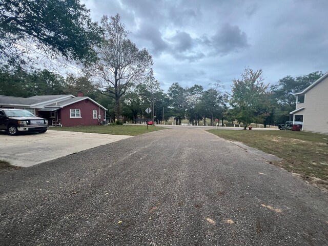 299 Carl Pl, Crestview, FL 32539 - view of asphalt road featuring traffic signs