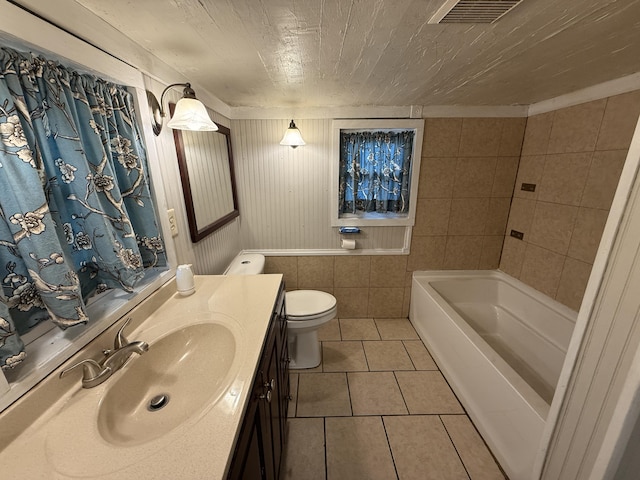 299 Carl Pl, Crestview, FL 32539 - bathroom featuring tile patterned flooring, vanity, toilet, and a tub