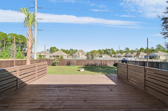 wooden terrace with a yard