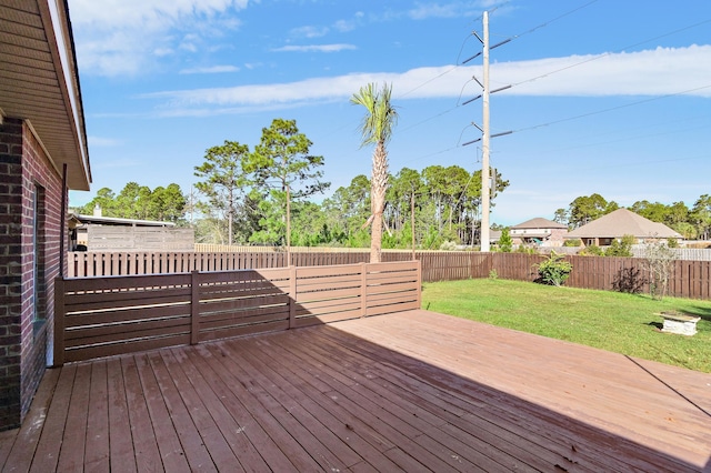 wooden deck with a lawn