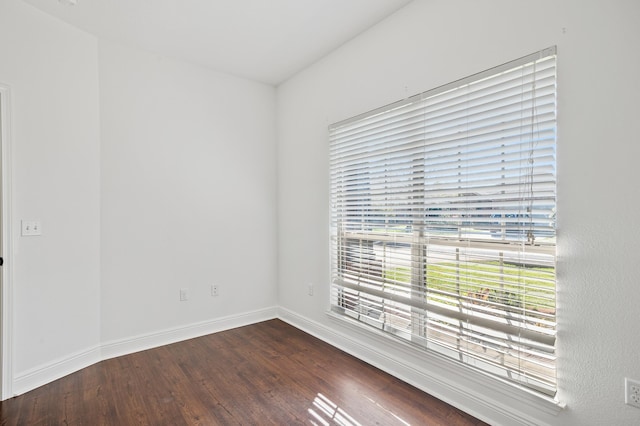 empty room featuring dark wood-type flooring