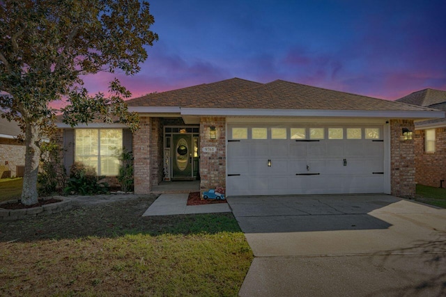9761 Leeward Way, Navarre, FL 32566 - single story home with an attached garage, brick siding, driveway, and a lawn