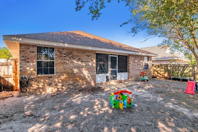 9761 Leeward Way, Navarre, FL 32566 - back of property with brick siding and a shingled roof