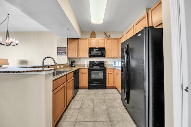 kitchen with kitchen peninsula, sink, black appliances, decorative light fixtures, and an inviting chandelier