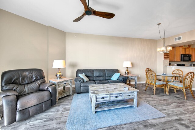 4203 Indian Bayou Trl Unit 11207, Destin, FL 32541 - living room featuring ceiling fan, a chandelier, and light wood finished floors