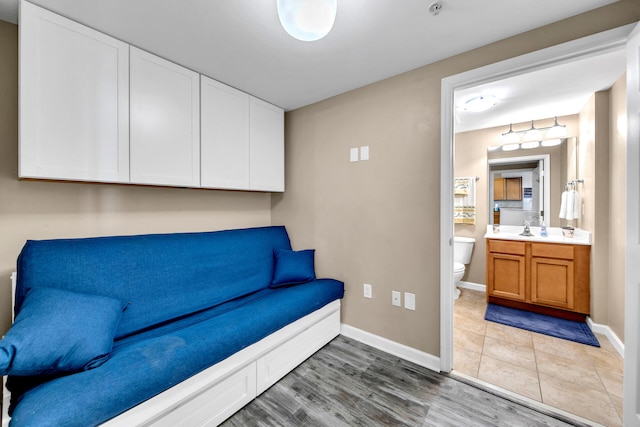 sitting room featuring light hardwood / wood-style floors and sink