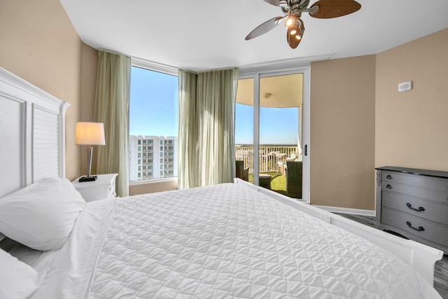 4203 Indian Bayou Trl Unit 11207, Destin, FL 32541 - bedroom featuring access to outside, multiple windows, and ceiling fan