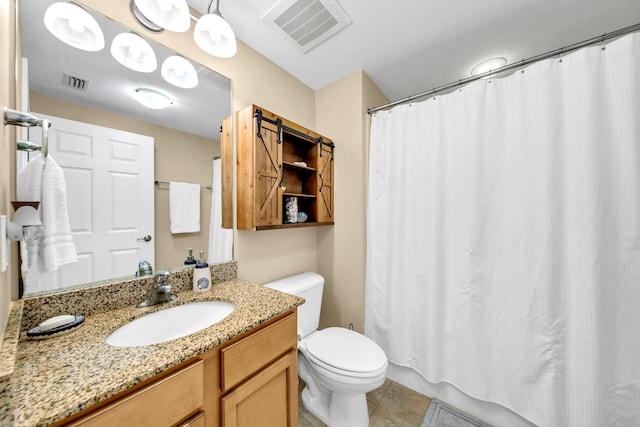 bathroom with tile patterned floors, vanity, a shower with shower curtain, and toilet