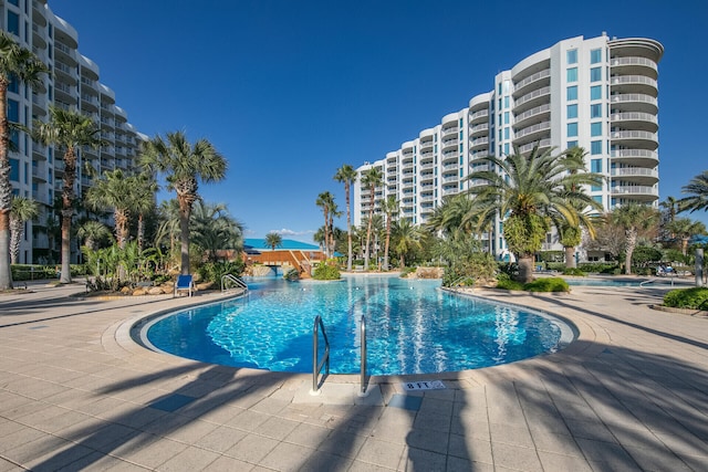 view of swimming pool featuring a patio area