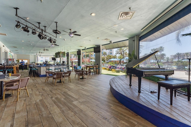 4207 Indian Bayou Trl Unit 2216, Destin, FL 32541 - wooden terrace with outdoor dining space and a ceiling fan