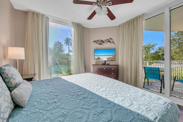 4207 Indian Bayou Trl Unit 2216, Destin, FL 32541 - bedroom featuring access to exterior and ceiling fan
