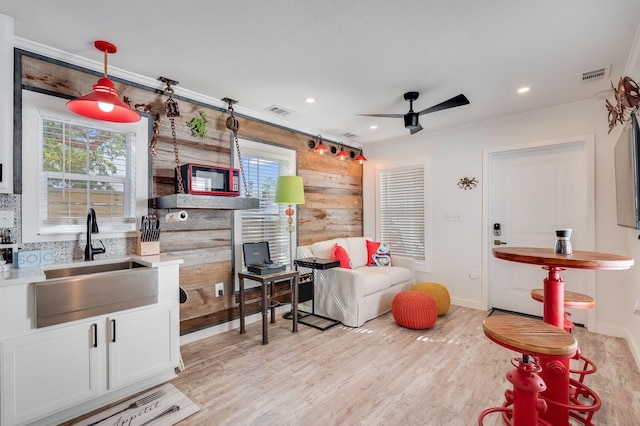 374 San Juan Ave, Santa Rosa Beach, FL 32459 - living room featuring ceiling fan, crown molding, healthy amount of natural light, wood finished floors, and recessed lighting