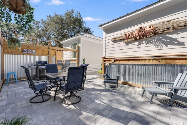 374 San Juan Ave, Santa Rosa Beach, FL 32459 - view of patio with outdoor dining area and area for grilling