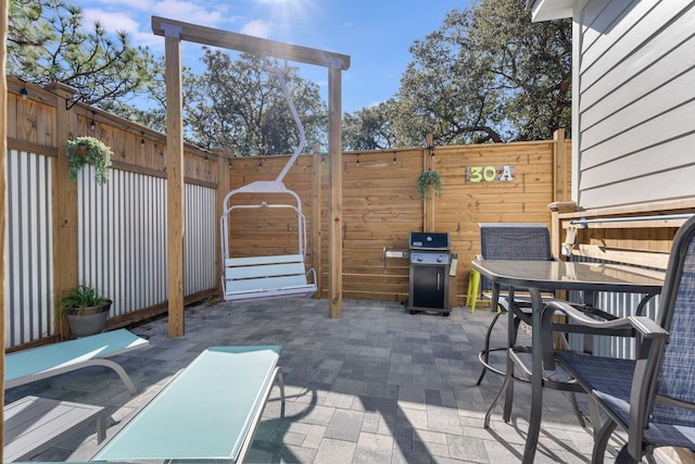 view of patio with a grill