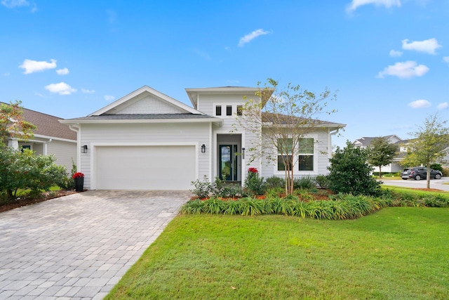 131 W Lafayette Rd, Inlet Beach, FL 32461 - view of front of property with a front yard, decorative driveway, and a garage