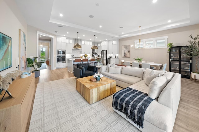 131 W Lafayette Rd, Inlet Beach, FL 32461 - living area featuring a raised ceiling, recessed lighting, and light wood-type flooring