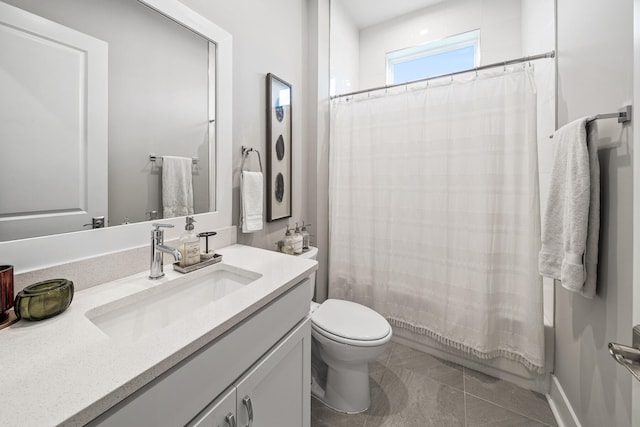 full bathroom with shower / bath combo with shower curtain, tile patterned flooring, vanity, and toilet