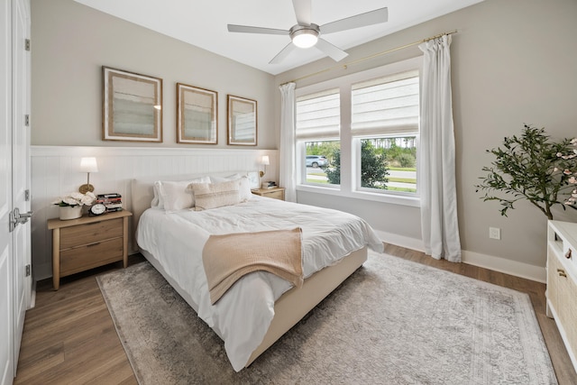 bedroom featuring ceiling fan and dark hardwood / wood-style floors