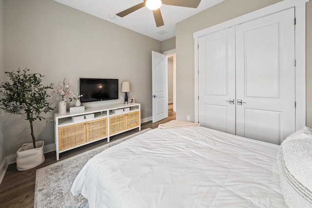 bedroom with a closet, ceiling fan, and hardwood / wood-style floors