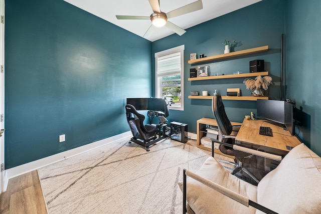 office featuring hardwood / wood-style flooring, ceiling fan, and vaulted ceiling