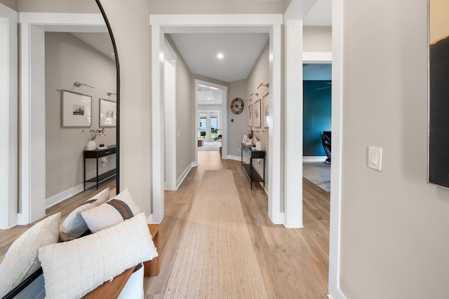 hallway with light hardwood / wood-style flooring