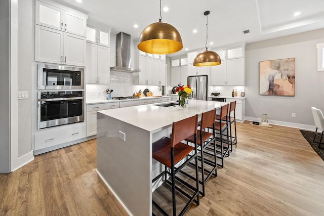 131 W Lafayette Rd, Inlet Beach, FL 32461 - kitchen featuring stainless steel appliances, wall chimney exhaust hood, recessed lighting, baseboards, and a sink