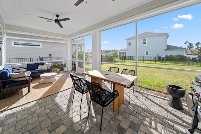 sunroom / solarium with ceiling fan