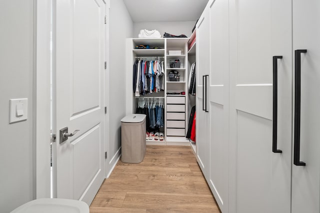 walk in closet featuring light wood-type flooring